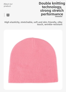 Detail of pink knit beanie showing dual-layer stitching with elastic and soft texture