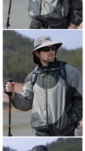 Detailed outdoor gear set with waterproof jacket, wide brim sun hat and hiking pole