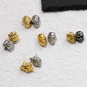 DIY jewelry beads in stainless steel featuring skull, wolf, and buddha head designs