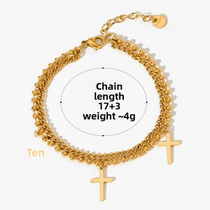 Detail of gold double-layer cross bracelet with 17+3cm length and S.Steel tag