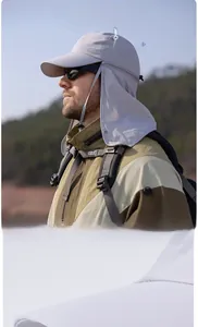Detail of grey sun hat with neck flap, wide brim, and laser-cut breathable side vents