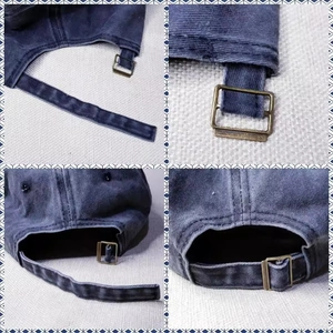 Detail view of washed navy cotton baseball cap featuring adjustable bronze metal buckle strap