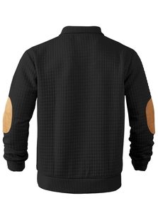 Rear view of black quilted sweatshirt with contrasting camel velvet elbow patches