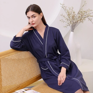 Dark blue waffle texture bathrobe for women and men with white piping and belted waist