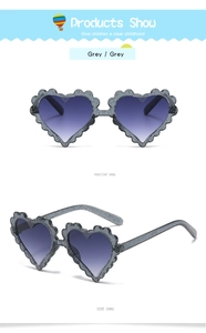 Detail view of heart-shaped grey children's sunglasses with transparent glitter frame