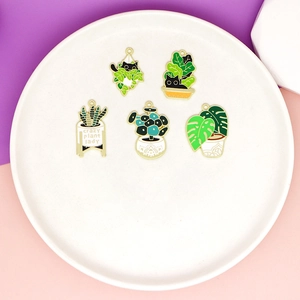 Enamel plant and cat pendants with crazy plant lady text on white ceramic plate