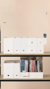 White minimalist desktop storage system with document racks and drawer boxes in modular layout
