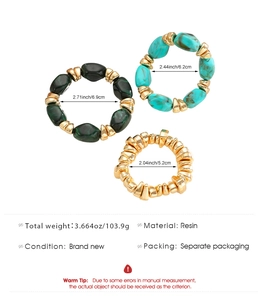 Detailed view of resin bangle set with marble patterns and irregular golden metal bracelet