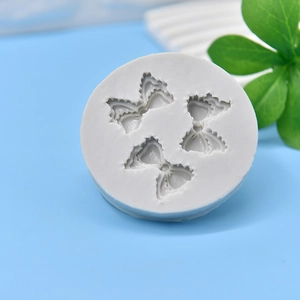 Round white silicone mold with three bow patterns for cake fondant and DIY resin crafting