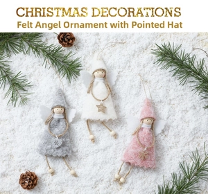 Three plush Christmas angel ornaments with pointed hats and wings on a snowy background