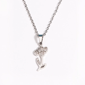 Detailed close-up of a silver stainless steel flower pendant with an O-chain necklace