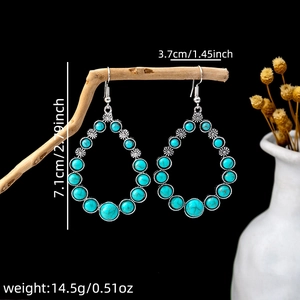 Retro turquoise earrings dimensions of 7.1cm height and 3.7cm width on wood