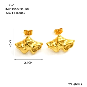 Macro detail of 18k gold plated stainless steel bow earrings with exact dimensions