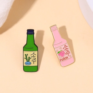 Creative cartoon enamel wine bottle brooches featuring fresh peach and bamboo designs
