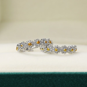 Minimalist daisy floral drop earrings in silver and gold two-tone metallic finish