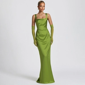 Detail of green satin evening gown featuring corset bodice and sheer mesh gloves