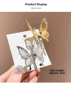 Close-up of gold and silver butterfly hair clips with 4cm metal alloy clip detail