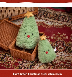 Close-up of soft green Christmas tree plush toys in 20cm and 30cm sizes with star detail