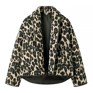 Detail of leopard print quilted cotton jacket featuring large lapels and front patch pockets