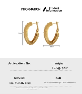 Detail view of gold C-shaped earrings with frosted texture and dimension of 3.8cm x 2.8cm