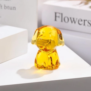 Macro shot of amber glass zodiac dog figurine with smooth finish and crystal clarity