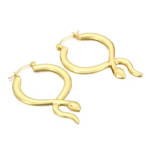 Macro view of gold-plated stainless steel snake hoop earrings with a polished finish