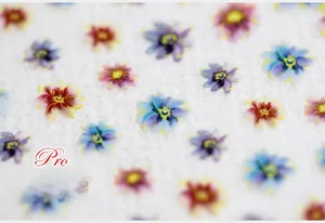 Macro detail of 5D floral nail stickers with matte finish and 3D textured flower patterns
