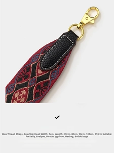 Detail of bohemian geometric woven strap with black leather ends and gold metal clasps