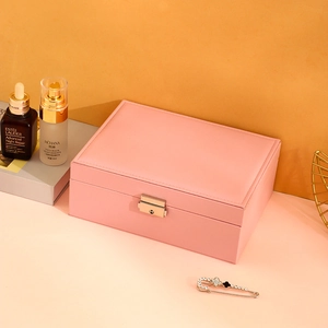 Pink PU leather jewelry organizer box with elegant metal lock and stitching details