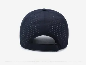 Detail of dark blue quick-dry baseball cap with laser-cut ventilation holes and velcro strap