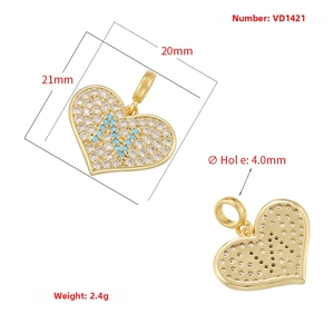 Macro view of heart-shaped diamond pendant with gold back honeycomb mesh texture