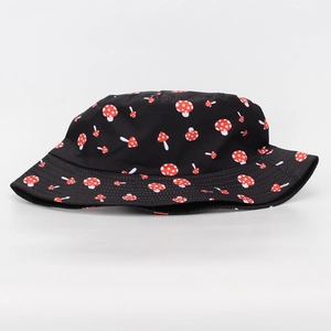Detail of black sun hat with cute red mushroom print and high-quality stitching