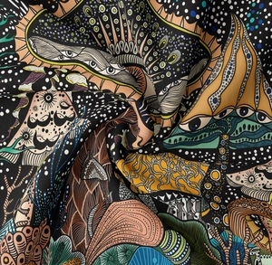 Vue détaillée du motif de champignon psychédélique et de la texture du tissu