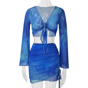 Blue tie-dye mesh two-piece set with V-neck tie-up top and ruched mini skirt
