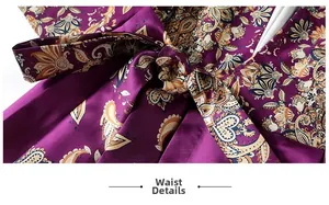 Detail view of purple paisley satin dress featuring a waist tie and elegant floral pattern