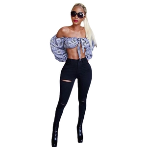 Women high waist ripped skinny jeans paired with a blue plaid off-shoulder crop top