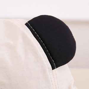 Detail of neat stitching on round panda ear decoration of children cotton sun hat