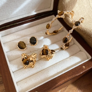Tiger eye stone geometric earrings in a wooden jewelry box with elegant gold plating