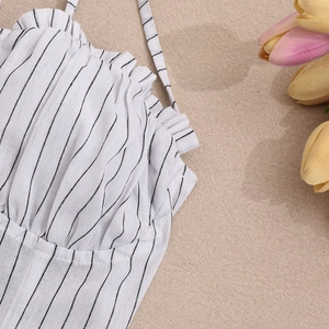 Detailed view of striped dress neckline with delicate ruffles and thin shoulder straps