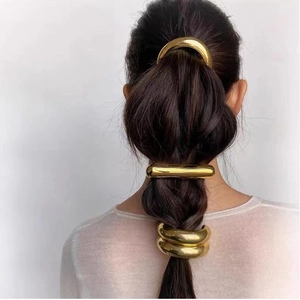 Polished gold metal chain hair ring set with minimalist geometric design for ponytails