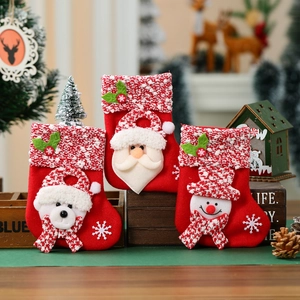 Three mini Christmas stocking gift bags with Santa, bear and snowman on felt fabric