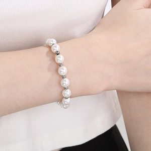 Elegant freshwater pearl bracelet with silver beads and lobster clasp on woman's wrist