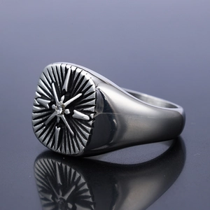 Silver punk signet ring for men featuring an engraved starburst and white zircon stone