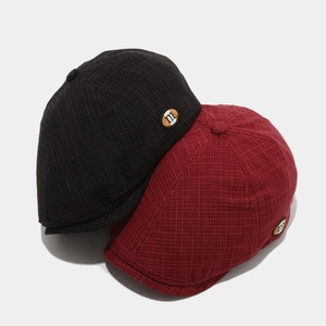 Classic plaid newsboy caps in wine red and coffee featuring a metal m logo badge