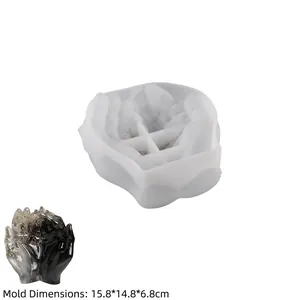 Detailed view of flexible hand-shaped silicone mold with textured palm finish