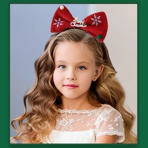 Detail of red plush Christmas headband with snowflake embroidery and Merry Christmas text
