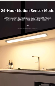 Detail of warm LED motion sensor light under kitchen cabinet with wireless magnetic mount