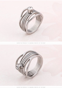 Detail view of silver hollow fishtail titanium steel ring with round zircon inlay