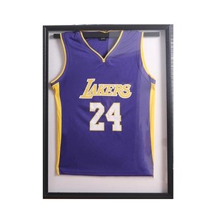 Lakers 24 basketball jersey displayed in a large black wooden memorabilia wall frame