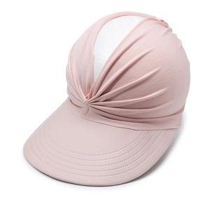 Close-up of pink pleated fabric and wide brim on sun hat for UV protection